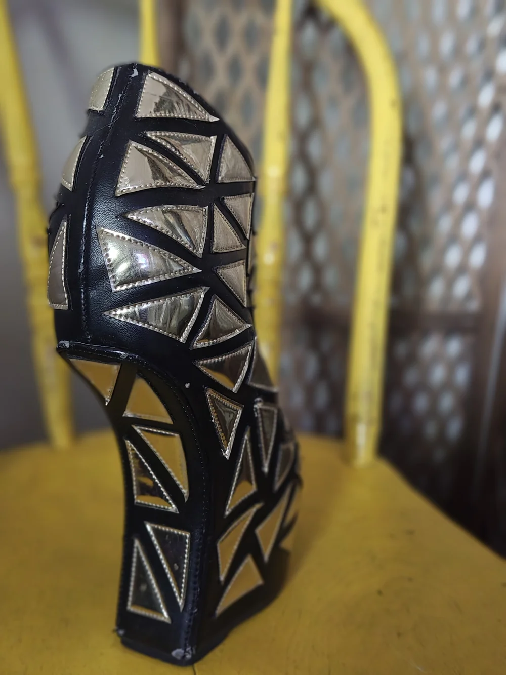 Prestiged Women's Black Ankle Wedge Booties with Gold Geometric Accents